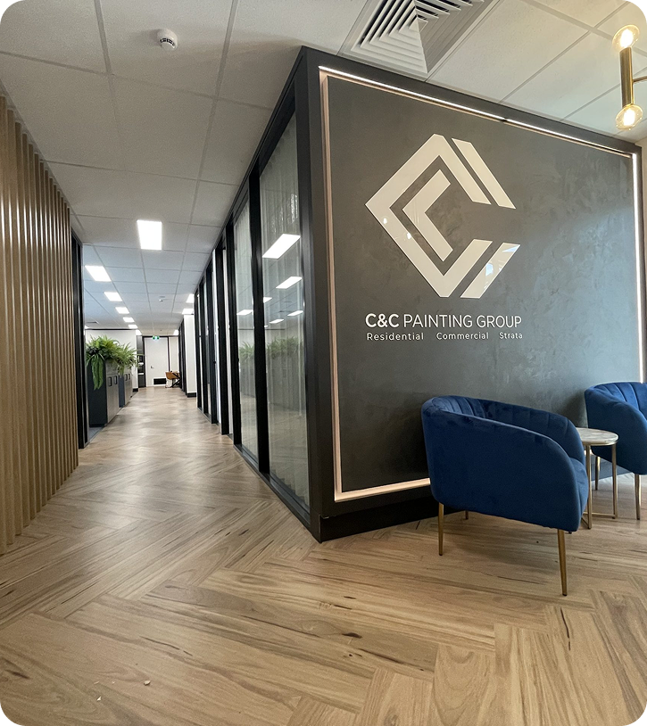 C&C Painting Group office interior featuring modern design, logo, and seating area, showcasing a professional environment for residential, commercial, and strata painting services.