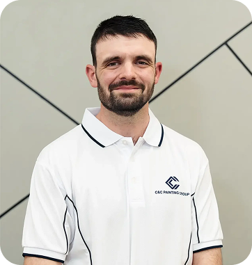 Jeremy Pieper, Acting Operations Manager at C&C Painting Group, wearing branded polo shirt, smiling against a modern geometric background.
