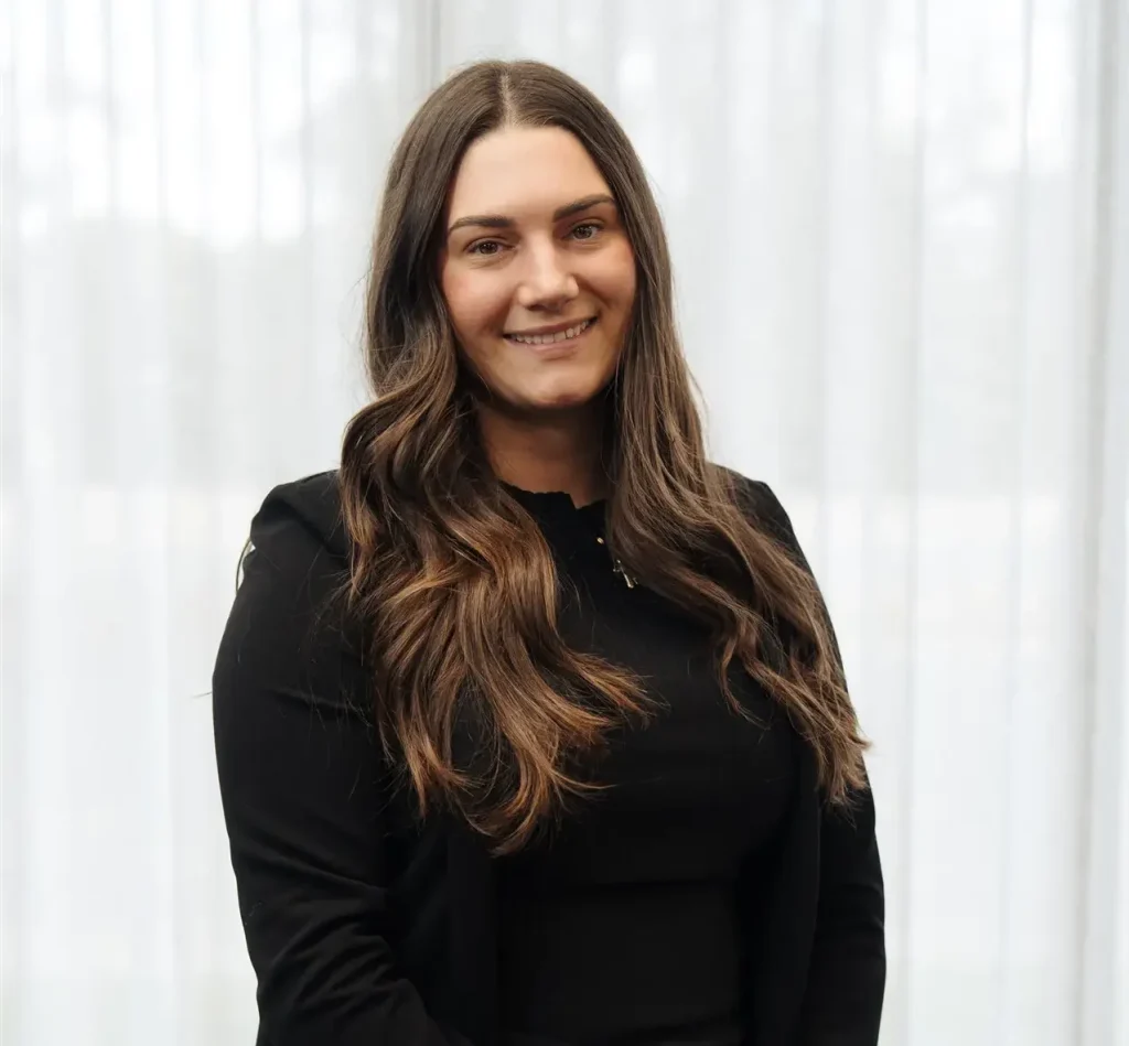 Natasha Campbell, Executive Operations Officer at C&C Painting Group, smiling in professional attire against a light background.