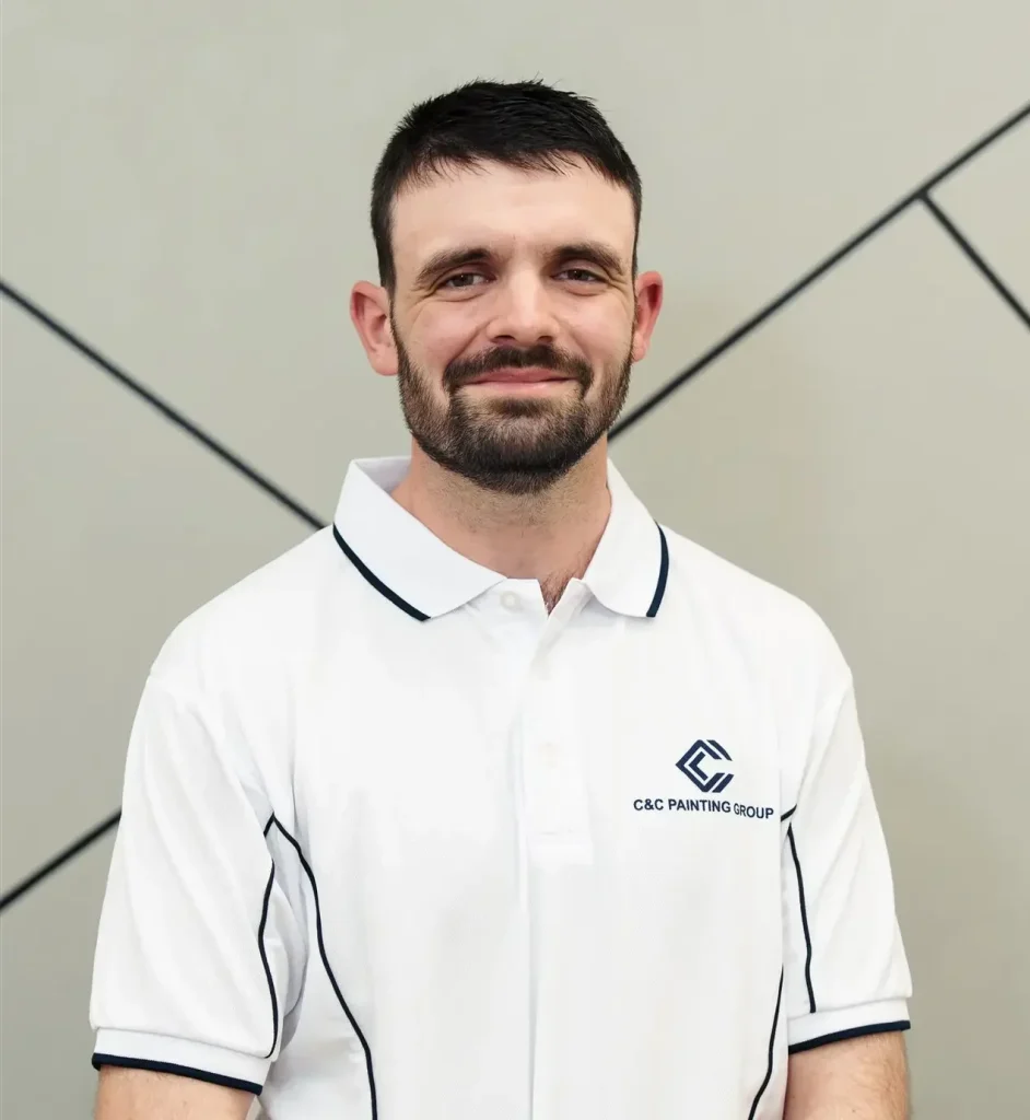 Jeremy Pieper, Acting Operations Manager at C&C Painting Group, wearing a branded white polo shirt, smiling against a neutral backdrop.